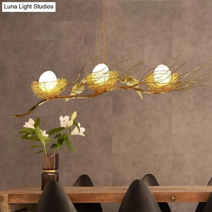 Decorbites modern gold nest island pendant chandelier with three egg-shaped bulbs in woven nests and bird decor