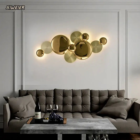 Modern gold nordic led wall lamp with spherical and disc-shaped elements for stylish living room decorbites gold nordic sconce