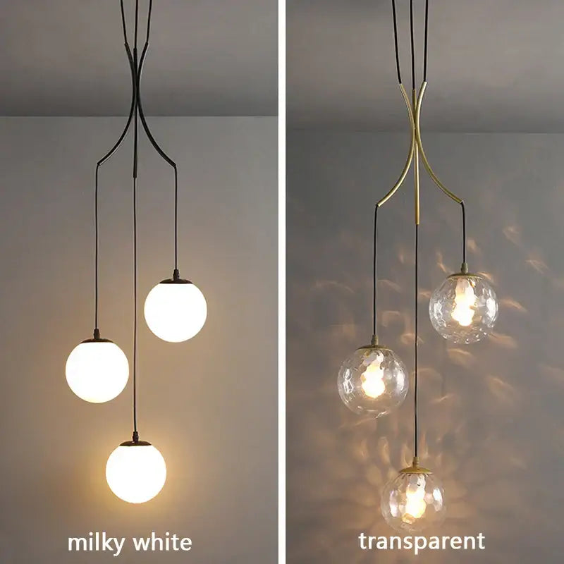 Modern gold nordic pendant light featuring milky white glass spheres with black and brass metal arms for dining room decorbites gold nordic