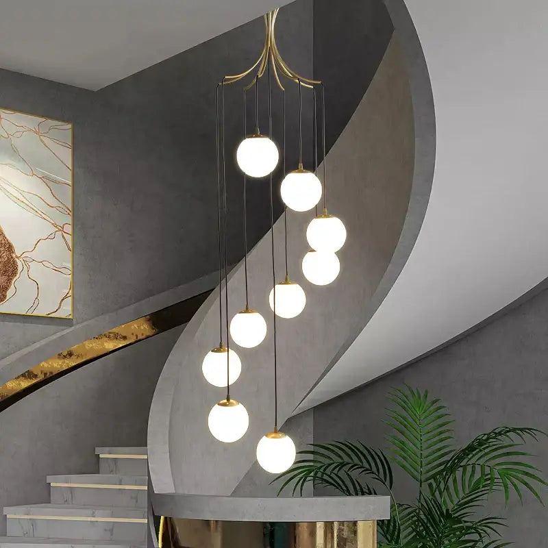 Modern gold nordic pendant light with seven white glass globes suspended by black cords for dining room decorbites gold nordic
