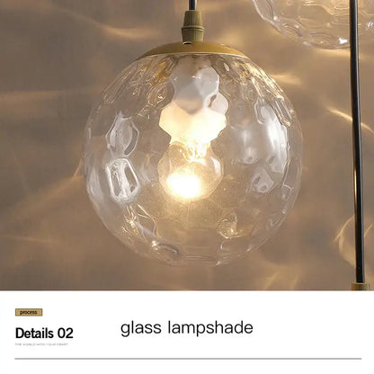 Clear textured glass lampshade with hammered finish and gold-toned metal fixture on decorbites gold nordic pendant light
