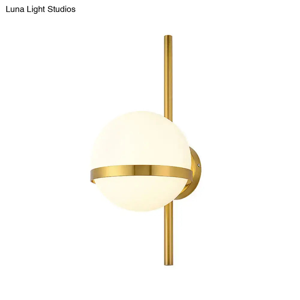 Modern gold opal glass orb wall sconce with gold finish frosted opal glass and horizontal accent band for living room light