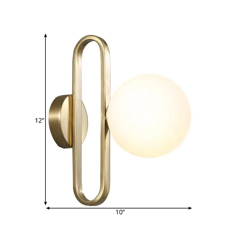 Modern gold brass-finished wall lamp with opal glass sphere and single light for bedroom use