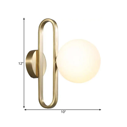 Modern gold brass-finished wall lamp with opal glass sphere and single light for bedroom use