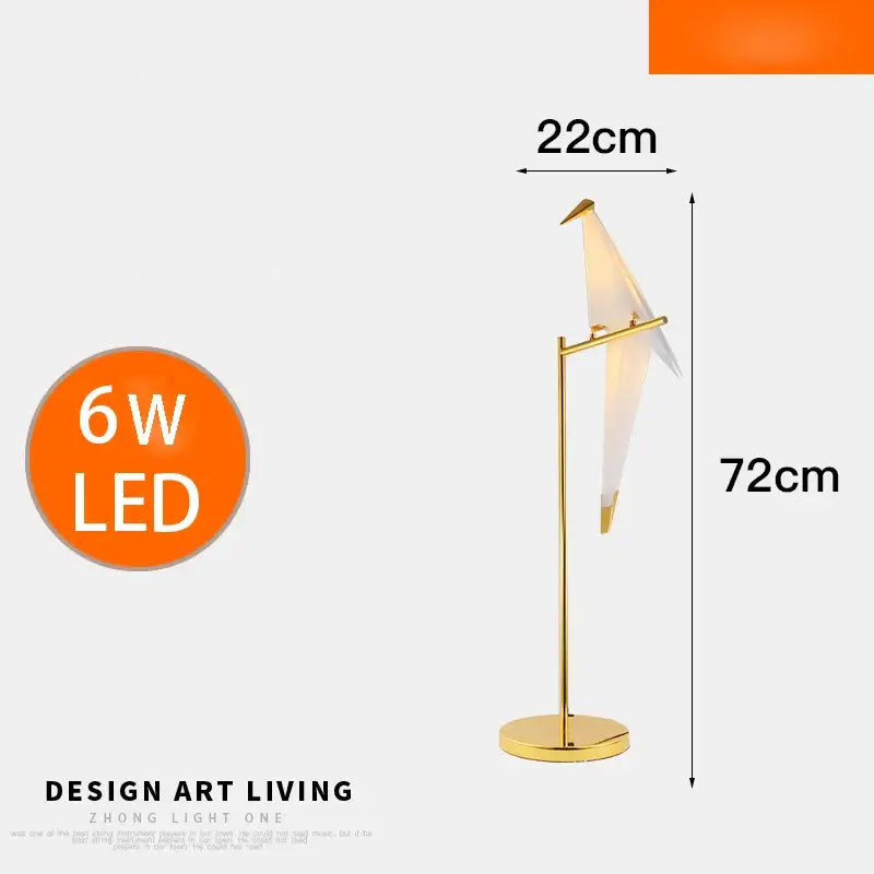 Modern gold floor lamp with a sleek origami bird shade providing elegant home decor and reading light