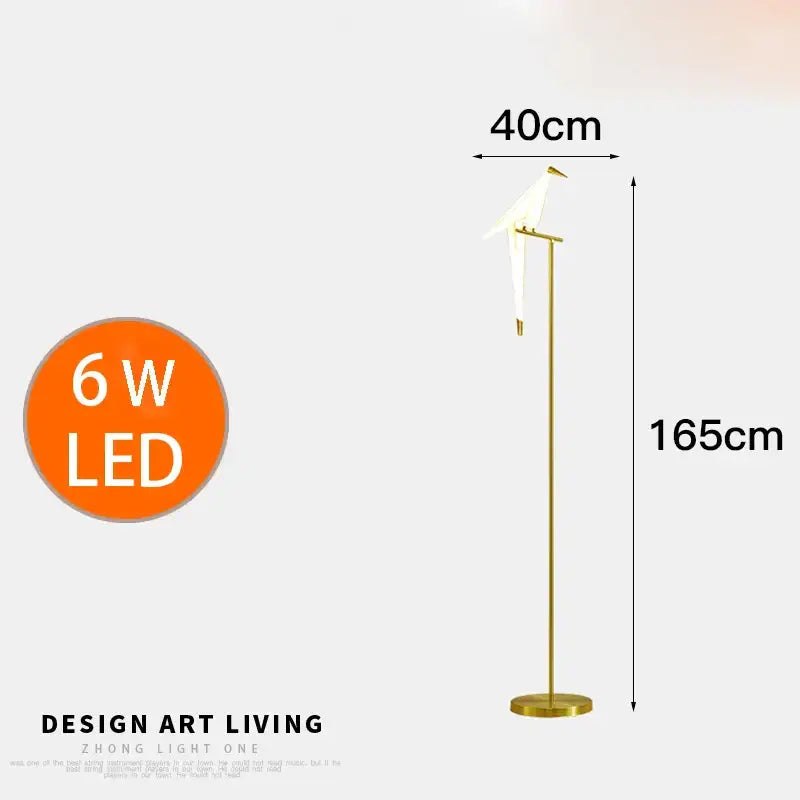 Modern gold origami bird floor lamp with a slender gold metal stand and white bird-shaped light for home decor