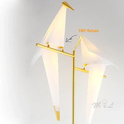 Gold-toned floor lamp with three white origami bird paper crane shades for modern home decor and reading light