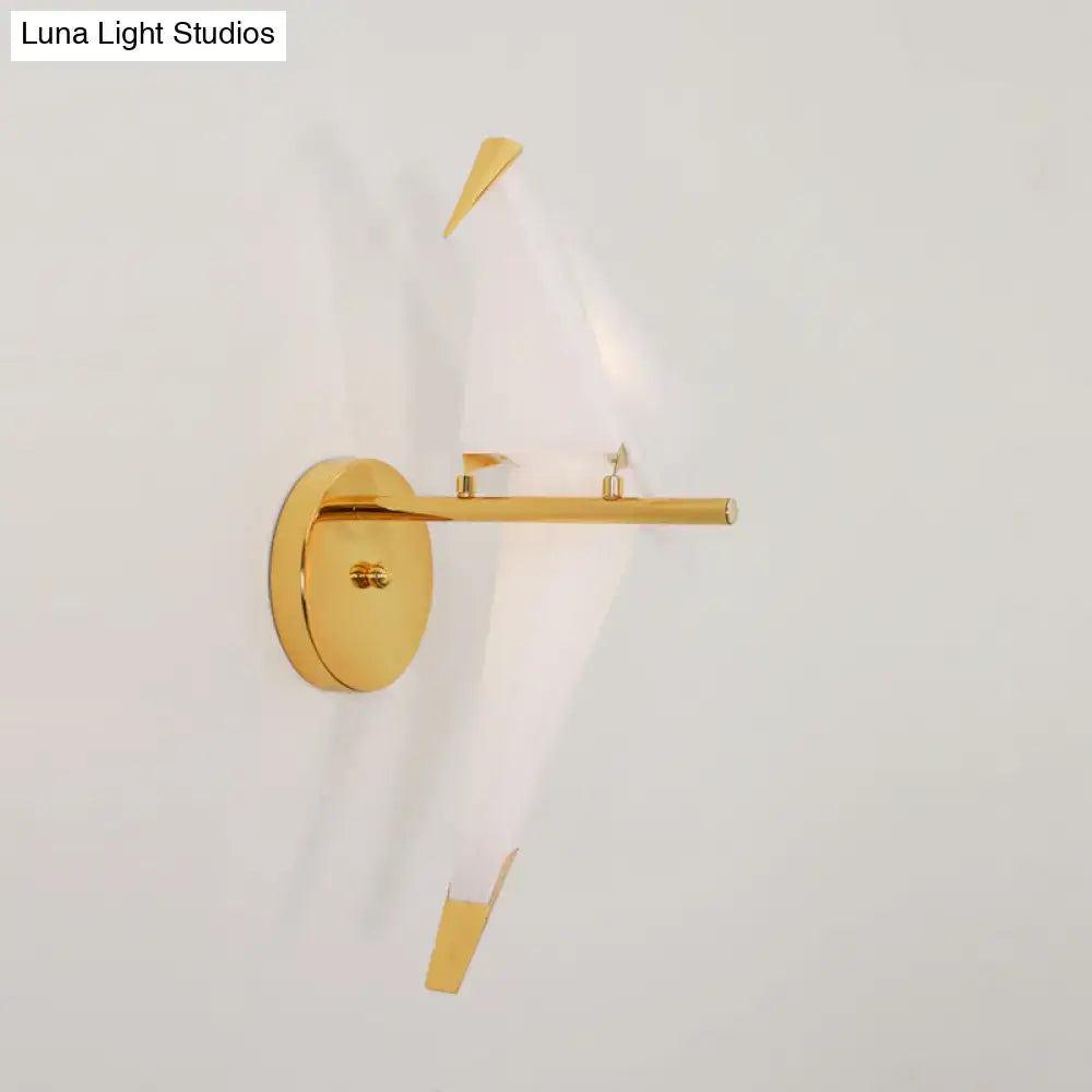 Modern gold origami bird led wall sconce with sleek circular base and angular arms for bedroom lighting fixture