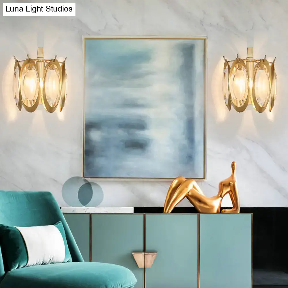Modern gold oval crystal wall light with gold-toned circular layered glass shades for living room light fixture