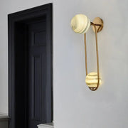 Modern gold oval wall sconce light fixture with cream marble shades and curved metal arms for living room sconce light