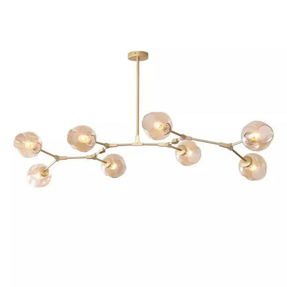 Modern gold painted metal pendant light with branching arms and frosted glass globe shades for dining room