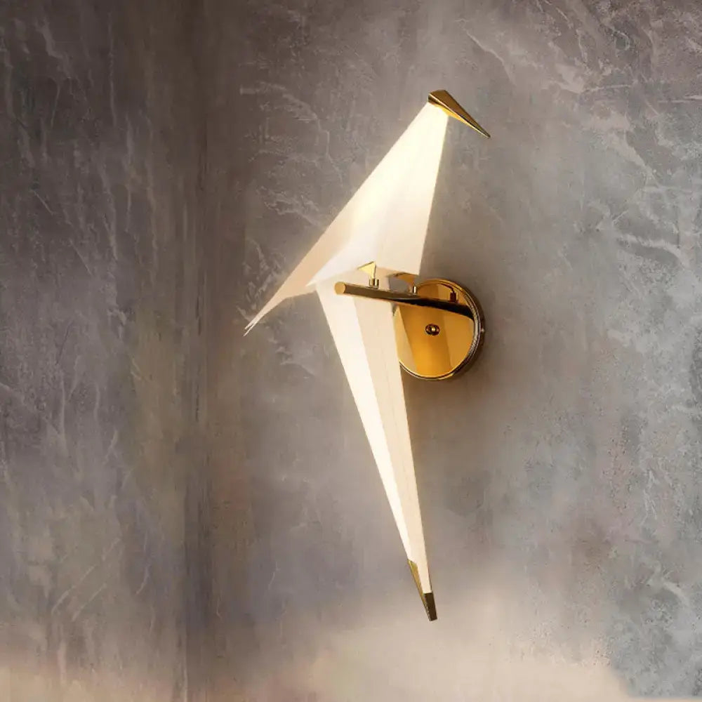 Modern gold-toned wall lamp dining room sconce with sleek origami design and frosted birdie plastic shade