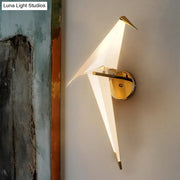 Modern gold paper crane wall lamp with birdie plastic shade and translucent white wings for dining room sconce use