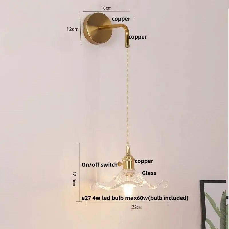 Modern gold petal led wall lights feature a brass finish with curved arm and clear glass shade for elegant decorbites led wall lighting