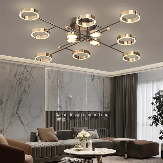 Modern gold plated chandelier with sleek black arms and circular ring lights for living room decorbites gold plated design