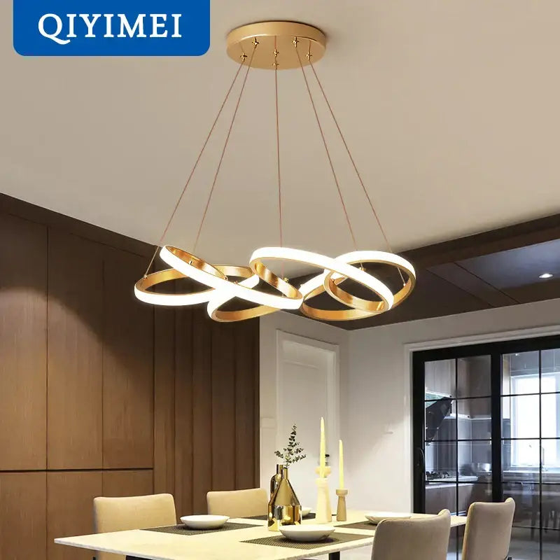 Modern gold plated led pendant lights featuring a gold-toned circular ring chandelier with intertwined design lighting