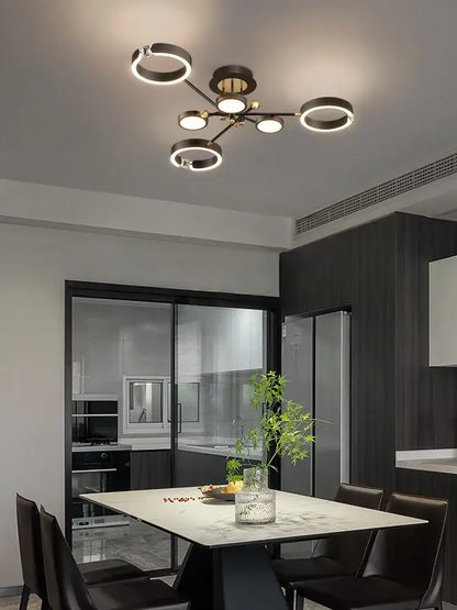 Modern black and brass circular pendant light fixture with illuminated rings gold plated luxury chandelier decorbites