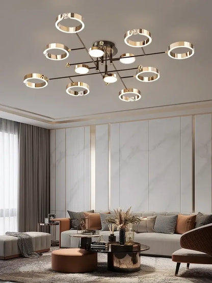 Modern gold plated luxury chandelier with circular ring lights and central metallic fixture for elegant decorbites gold plated decor
