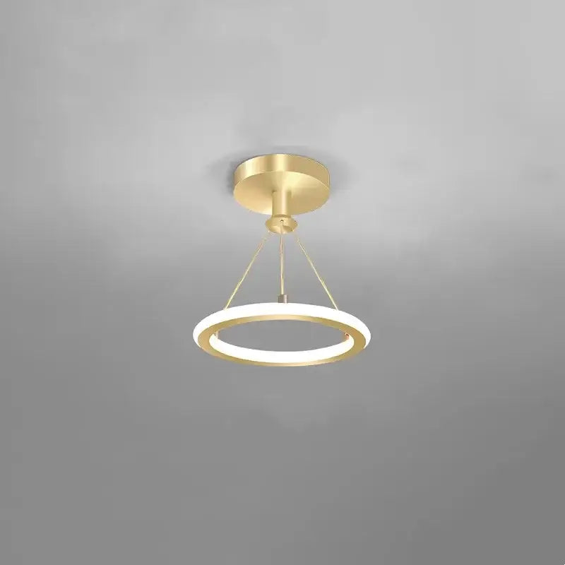Modern gold plated luxury chandelier with a circular glowing white ring and minimalist design for living room decorbites gold plated