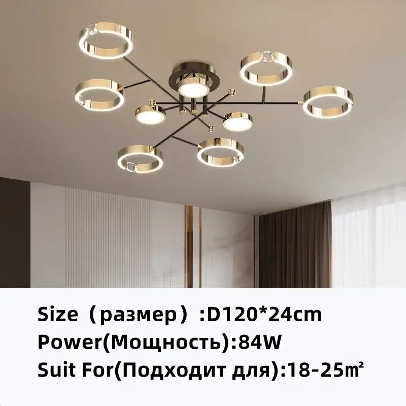 Modern gold plated luxury chandelier with eight circular rings and black metal arms emitting warm glow for living room decorbites gold plated