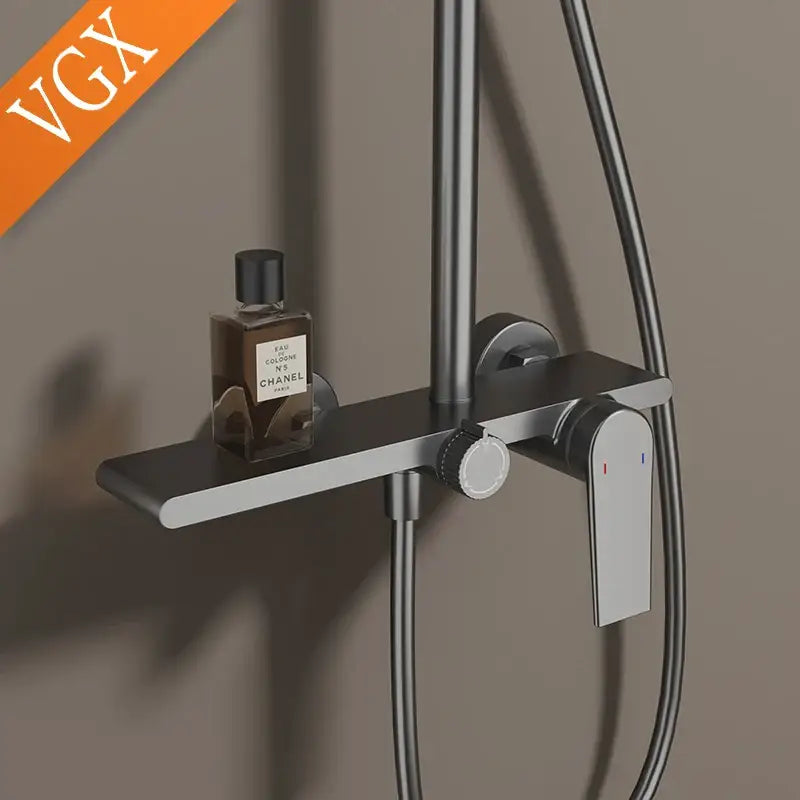 Modern matte black shower set with integrated shelf holding Chanel perfume bottle for elegant bathroom shower use