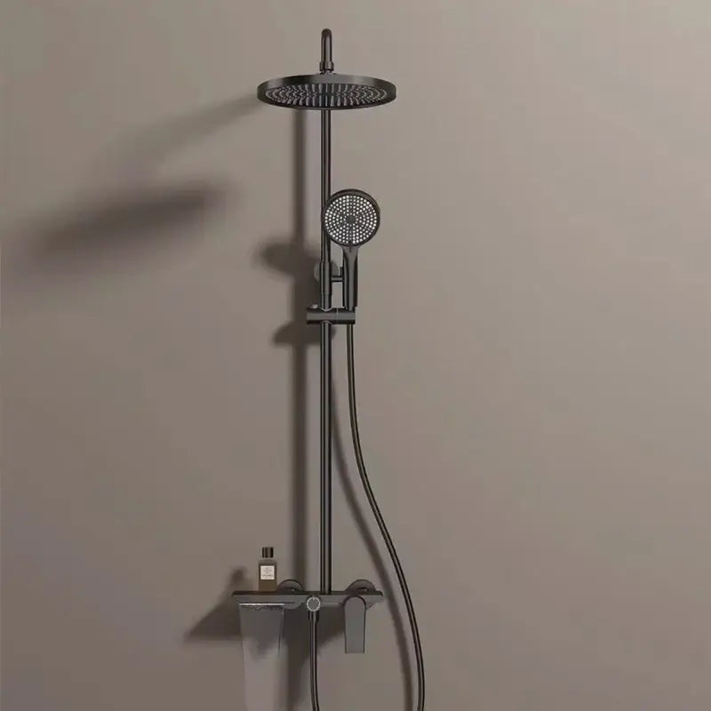 Modern matte black shower set with round rainhead and hand shower for a bathroom shower with gold accents