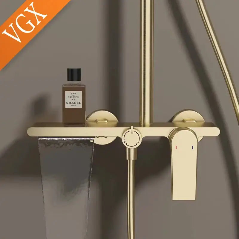 Modern gold rainfall shower set with hand shower featuring a gold-toned minimalist bathroom shower faucet with integrated knobs