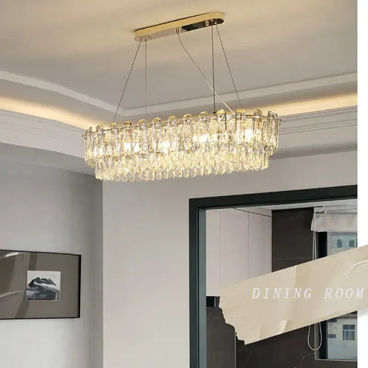 Modern gold rectangular crystal pendant chandelier with metal frame and cascading clear droplets for dining room decorbites crystal pendant