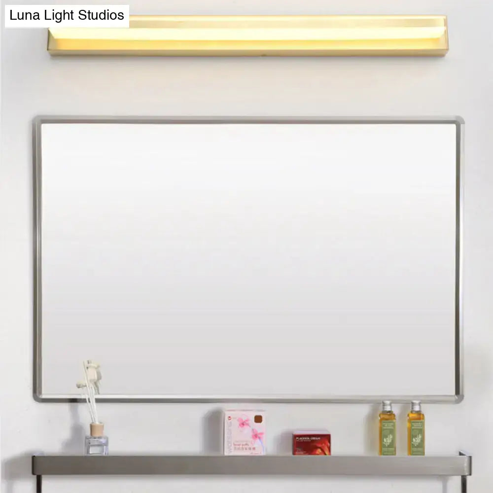 Modern gold rectangular led wall sconce with acrylic shade above silver-framed whiteboard and matching shelf