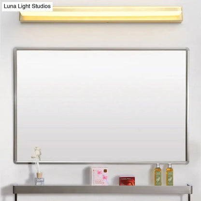 Modern gold rectangular led wall sconce with acrylic shade above silver-framed whiteboard and matching shelf