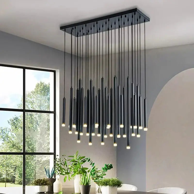 Modern gold rectangular pendant lights featuring black frame with slender warm LED rods for elegant dining room decorbites chandelier