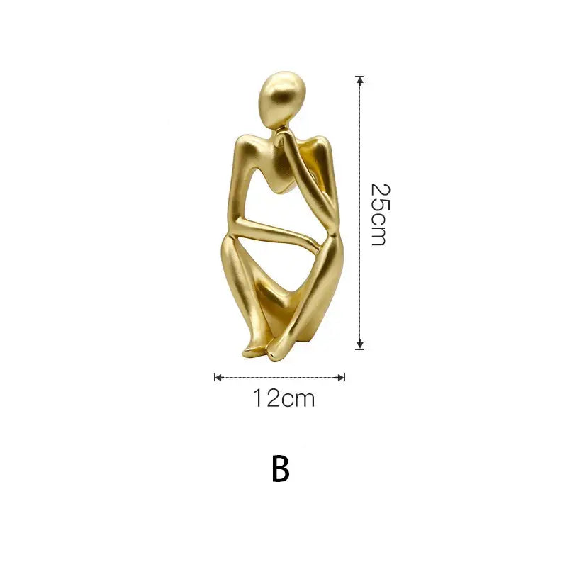 Modern gold resin sculpture featuring a minimalist abstract seated human form with sleek contours decorbites gold resin decor