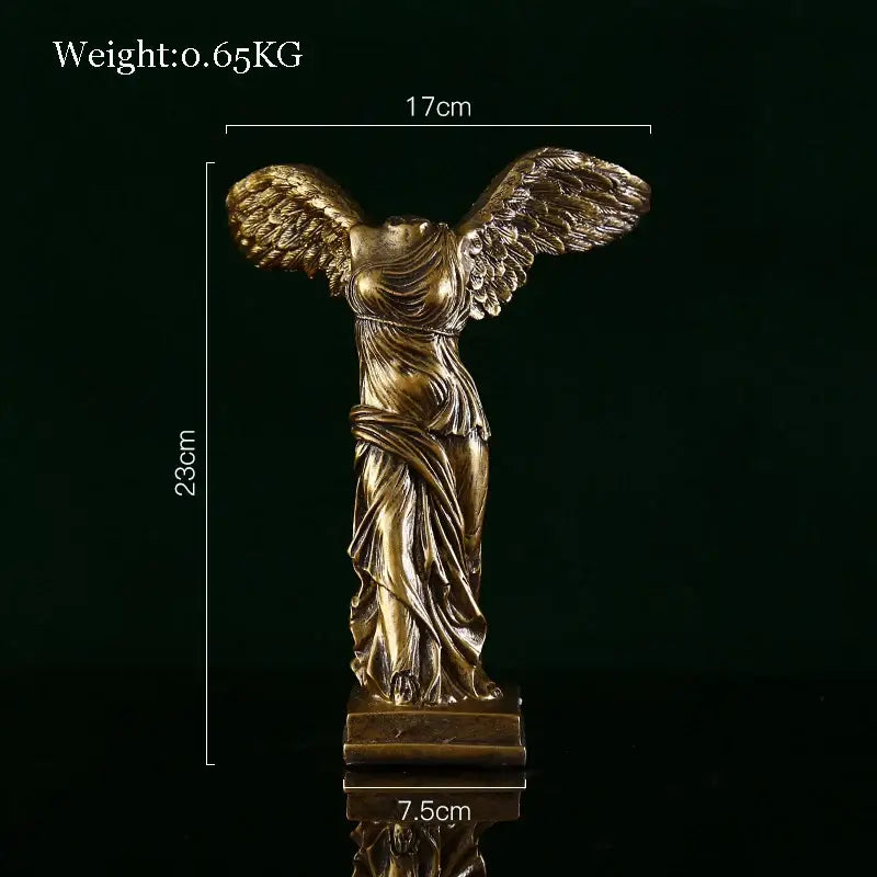 Modern gold resin sculpture of winged victory with detailed wings and draped fabric by decorbites gold resin decorbites gold