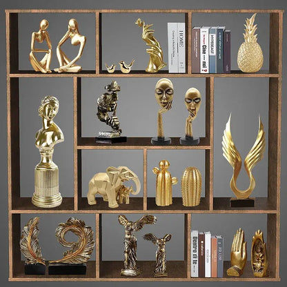 Modern gold resin sculpture living room abstract figurine featuring decorbites gold resin figurines on wooden shelf