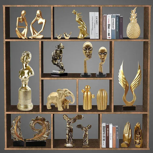 Modern gold resin sculpture living room abstract figurine featuring decorbites gold resin figurines on wooden shelf