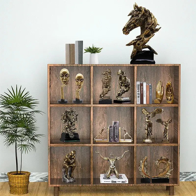 Modern gold resin sculpture living room abstract figurine featuring a golden horse head with intricate detailing on a dark base decorbites gold resin