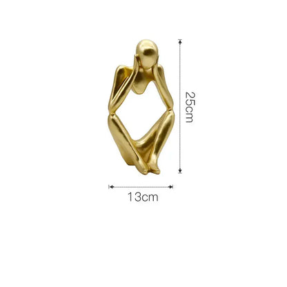 Modern gold resin sculpture living room abstract figurine of a gold resin seated human in contemplative pose by decorbites gold