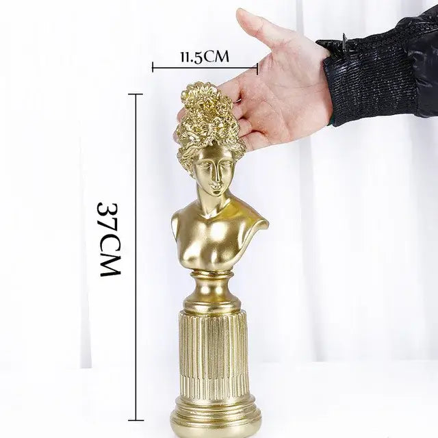 Modern gold resin sculpture featuring a golden resin bust with intricate curly hair on a fluted pedestal base by decorbites gold resin