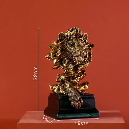 Modern gold resin sculpture featuring a detailed golden lion head with mane and paw on a black base for decorbites gold resin decor
