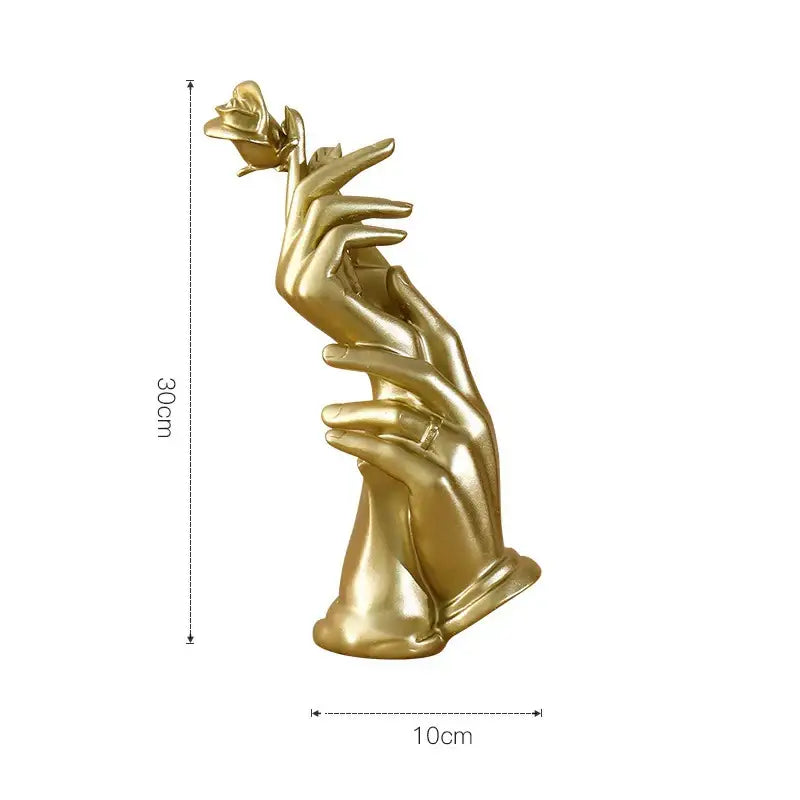 Modern gold resin sculpture featuring two hands delicately cradling a rose by decorbites gold resin decorbites gold