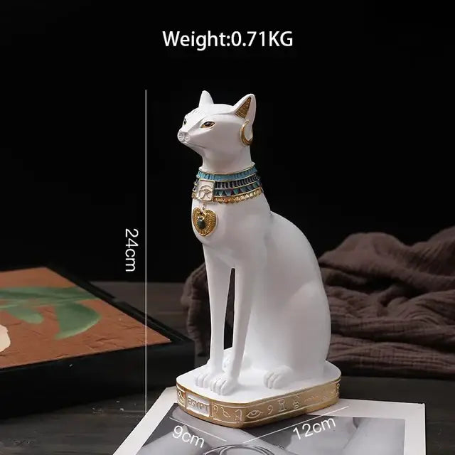 Modern gold resin sculpture featuring a white ceramic cat figurine with gold resin sculpture detailing by decorbites gold