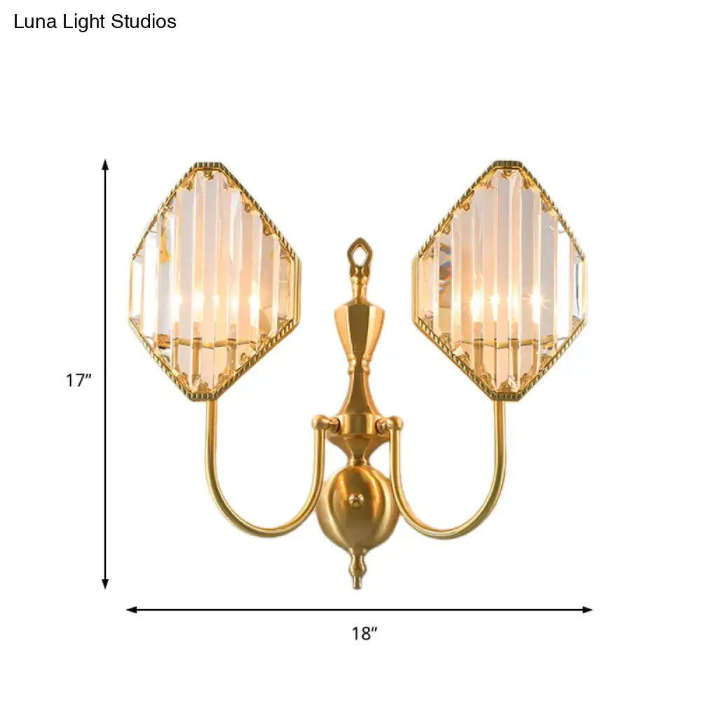 Modern gold wall lamp with two hexagonal crystal prism wall shades featuring vertical prismatic cuts for bedroom use