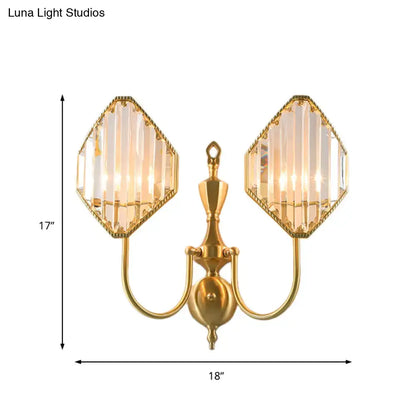 Modern gold wall lamp with two hexagonal crystal prism wall shades featuring vertical prismatic cuts for bedroom use