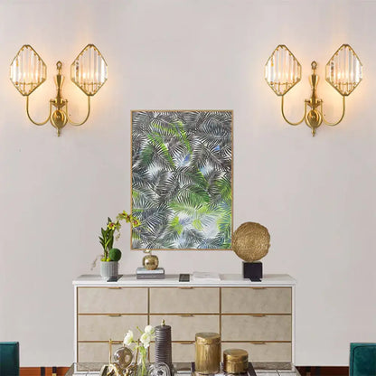 Modern gold wall lamp featuring faceted crystal prism shades in a rhombus prism wall mount design for bedroom use