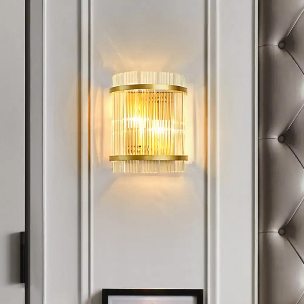 Modern gold ribbed glass living room wall mount light with vertical crystal rods and warm glowing light