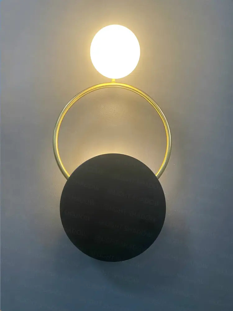 Modern gold ring ball g4 round wall lamp with decorbites glass ball and matte black base for bedroom sconce decor