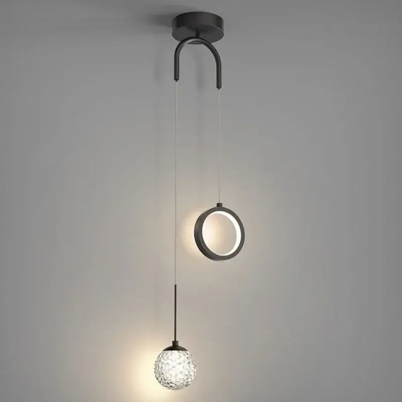 Modern black metal pendant light with a circular ring and faceted glass globe for decorbites gold ring led lighting