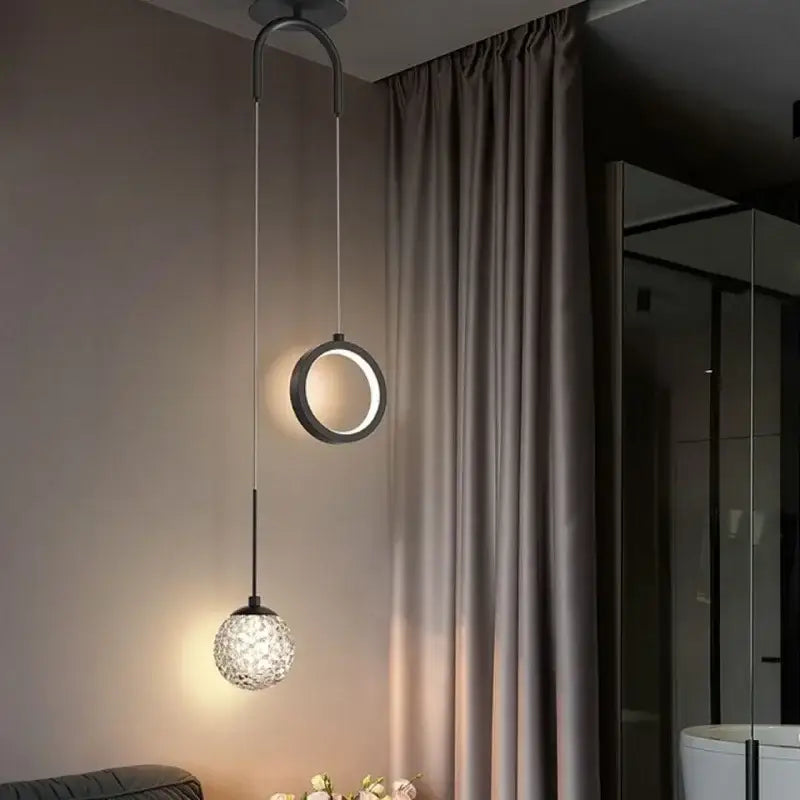 Modern gold ring led pendant light featuring a sleek black circular ring and crystal globe by decorbites gold ring