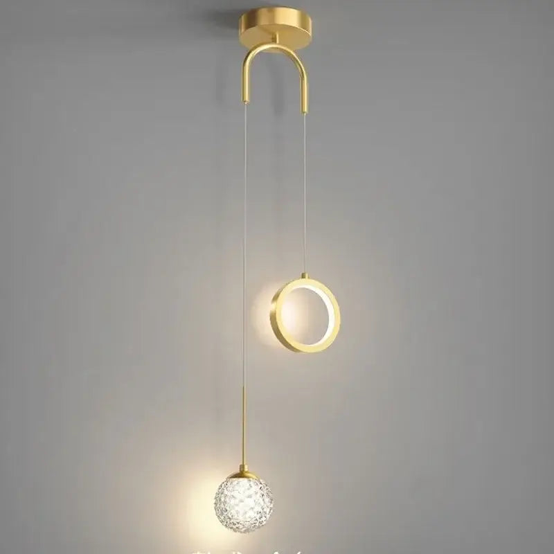 Modern gold ring led pendant light with decorbites gold ring design featuring a curved mount and crystal globe for living room decor