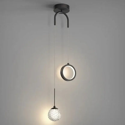 Modern black metal pendant light fixture with a circular ring and faceted glass globe for decorbites gold ring led lighting